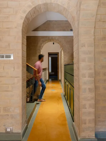 The arched hallway, a recurring motif in the house that creates a sense of rhythm.