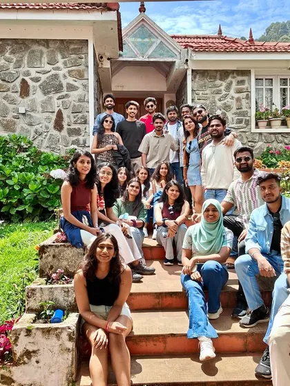 The full batch posing on the steps of our charming stone-walled stay in Kodaikanal.
