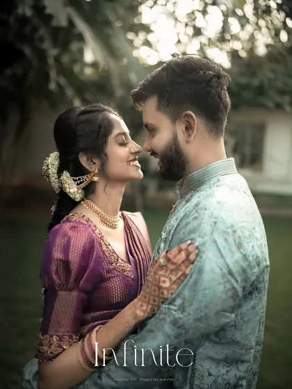 Looking into each other's eyes, lost in your own world. This close-up shot highlights the deep bond and anticipation before the wedding day.