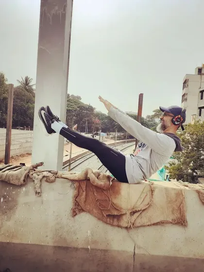 The Pilates teaser is a classic core challenge. I like to do it anywhere, even on a wall overlooking the city. It proves that all you need is your own body to build serious strength.