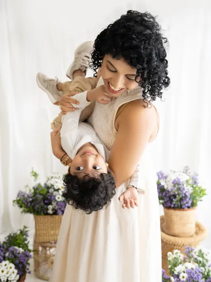Pure, unfiltered fun between a mother and her son. This playful, upside-down pose is a perfect example of the candid and joyful moments I aim to capture during our parent and child sessions.