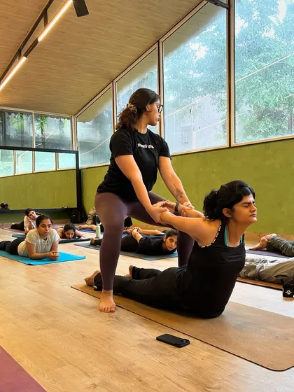 A snapshot from our teacher training workshop, focusing on a hands-on adjustment for Bhujangasana (Cobra Pose). We guide you on how to provide support that encourages spinal extension and opens the chest, ensuring your student feels secure and can explore the pose more deeply.