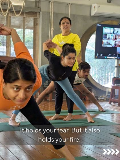 This image captures the essence of our practice. Students are engaged in various poses, some looking inward, some receiving adjustments. It shows that the journey to emotional wellness is personal but supported by the group's collective energy.