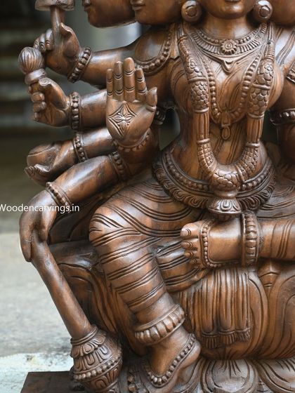 A detail of the ten hands of the Gayathri Devi, each holding a symbolic weapon or object.