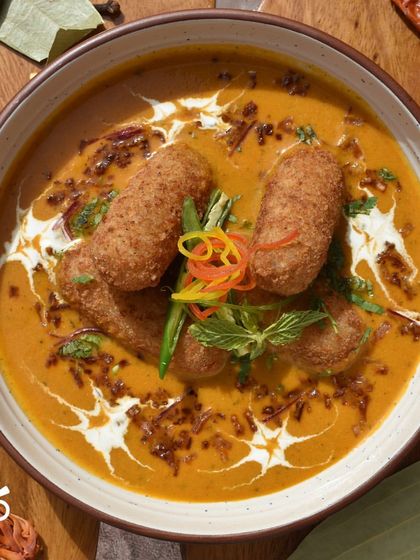 My Winter Vegetable Kofta features soft koftas dipped in a flavorful curry. It's a comforting and hearty dish that's perfect for a family meal, especially on a cool evening.