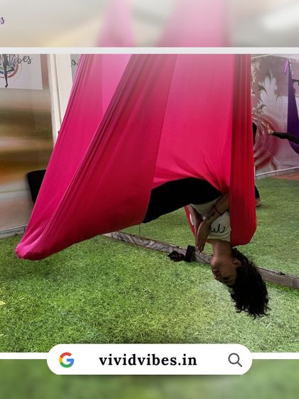 There's nothing like aerial yoga to make you feel free and alive. This student is enjoying a moment of playful inversion.