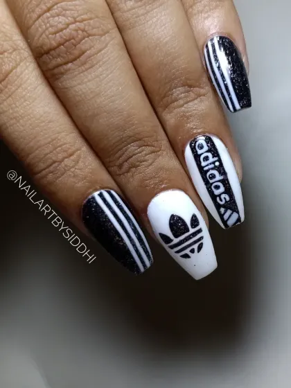 Another shot of the Adidas-branded nail art on coffin-shaped extensions.