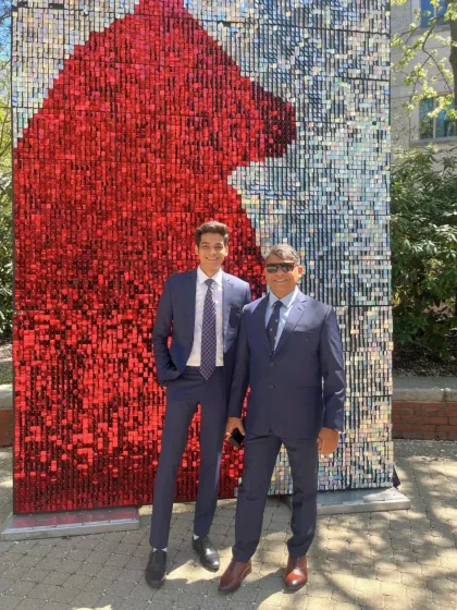 Commanding presence and classic style. Two clients are seen here in perfectly fitted navy blue suits, showcasing the timeless appeal and sartorial power of a well-made garment.