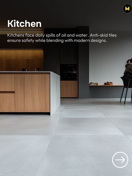 Kitchens face daily spills of oil and water. Anti-skid tiles ensure safety underfoot while blending seamlessly with modern designs, like these large-format grey tiles.