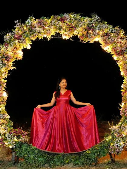 You don't need to worry about your pre-wedding outfits. This comfortable yet stunning red satin gown allows you to move and dance freely while looking your best.