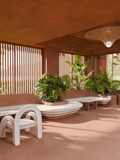The restaurant seating area is wrapped in the warm embrace of terracotta walls and soft curves. Light filters through louvred windows, filling every moment with grace.