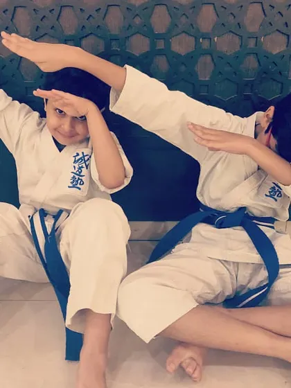 After a successful demonstration, our youngest members show us how to celebrate. Karate training is serious, but we always make room for fun.