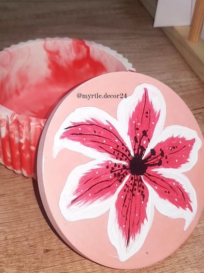 A custom order for a lovely customer: a hand-painted lily on the lid of our round marble jar. We love bringing your creative ideas to life.