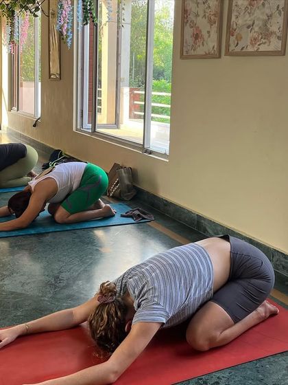 A moment of surrender in Balasana, or child's pose. We encourage students to listen to their bodies and rest when needed.