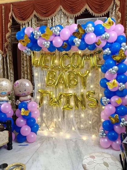 Double the joy! A special "Welcome Baby Twins" decoration. We used a mix of pink and blue balloons to celebrate the arrival of both a boy and a girl.