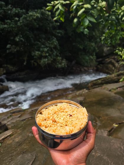 Enjoying a packed lunch with a view of a rushing stream. We make sure our trekkers are well-fed and energized.