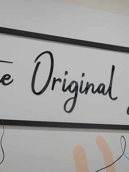 A close-up of our motto on the wall: "the Original you." This is at the heart of our philosophy.