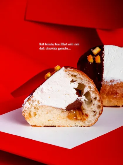 A look inside the Dark Chocolate Orange Maritozzo, revealing the soft brioche, rich ganache, and zesty marmalade.