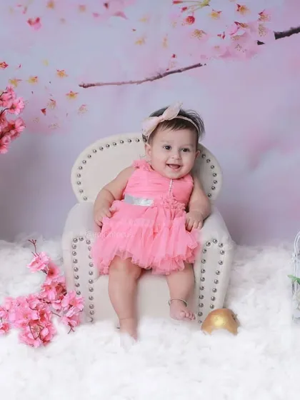 A full view of the enchanting cherry blossom set, complete with a miniature armchair, fluffy white clouds, and delicate pink flowers.