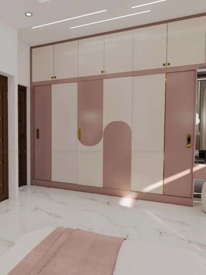 A sliding wardrobe with a unique, curved pink and white design, adding a playful yet chic touch to the bedroom.