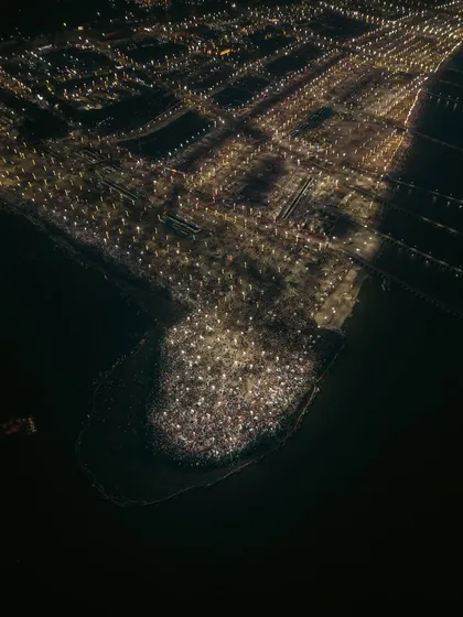 An aerial night shot of the Mahakumbh Mela, where the gathering of millions for the holy dip creates a constellation of light against the dark river. This image highlights my expertise in low-light drone photography for large-scale events, capturing the spiritual energy of the world's largest gathering.