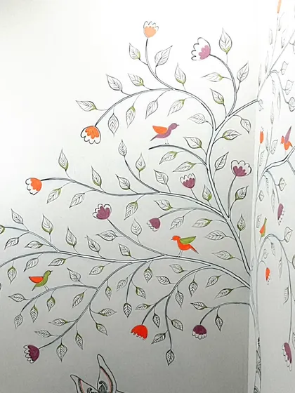 A flowering tree with little birds, painted along the corner of the staircase wall. This element connects the different animal motifs and adds a touch of life and nature.