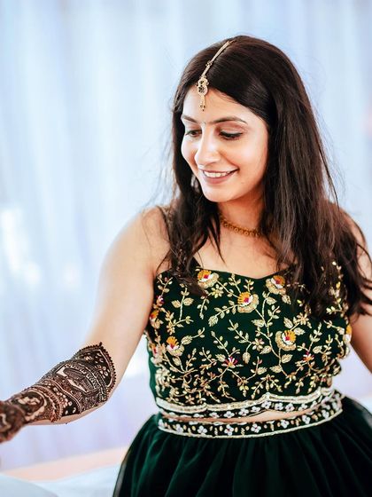 The bride-to-be getting her Mehendi done, a classic and essential part of the pre-wedding journey.