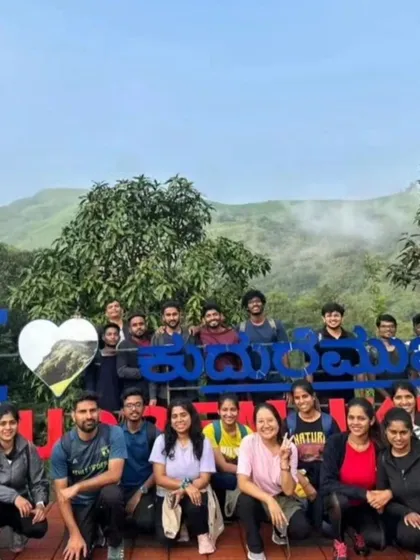 A group photo at the "I Love Kudremukha" sign, a popular spot for trekkers to capture a memory of their visit.
