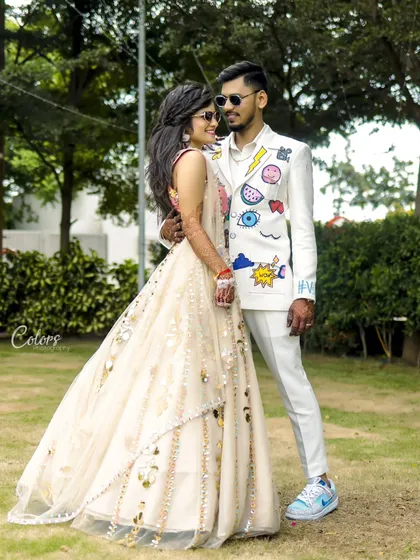 Your style is part of your story. I love it when couples bring their unique fashion sense to a shoot, like this groom's custom-painted jacket for their Haldi ceremony.