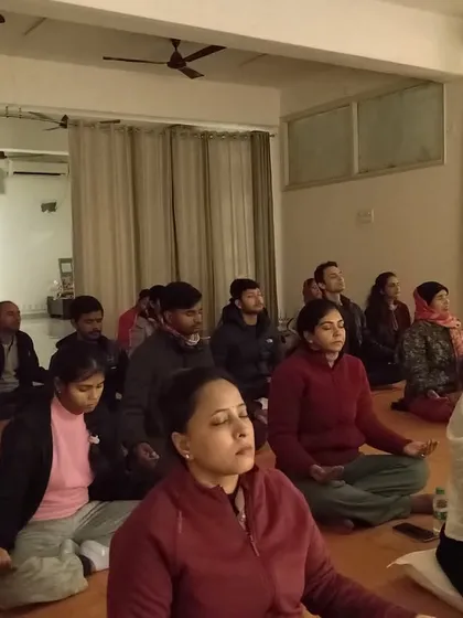 Participants sitting in stillness during a gathering. The rituals fill every corner of the space with transformative energy and a profound sense of peace.