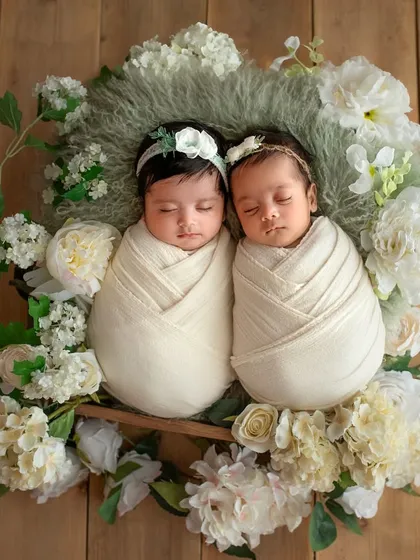 Double the joy! I have a special place in my heart for twin sessions. These two little angels are swaddled snugly together in a beautiful wreath of white flowers, a memory their parents will cherish forever.