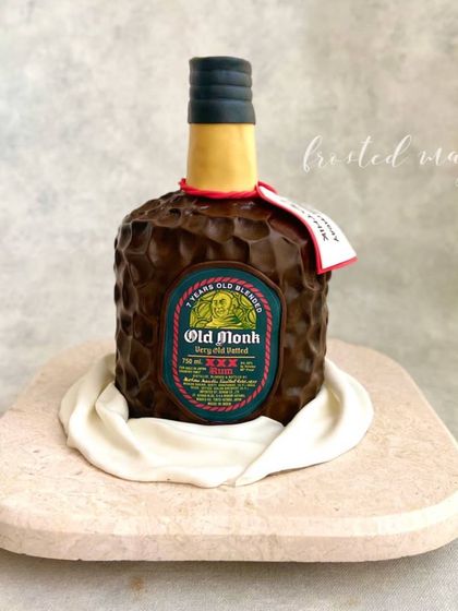 It's time for Old Monk! This cake is sculpted to look exactly like a bottle of the iconic rum. It was a really fun project, focusing on getting the shape, texture, and label just right.