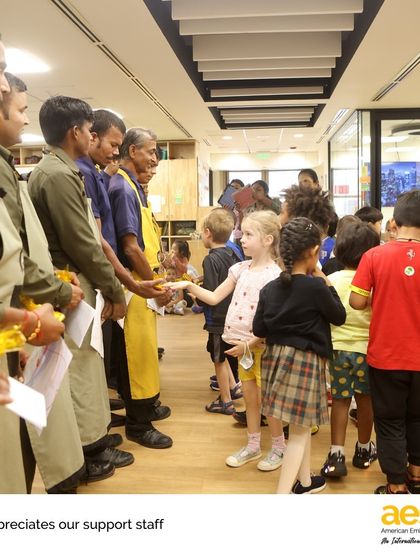 A student shares a moment of connection with a staff member. We believe that teaching appreciation and kindness is as important as any academic lesson.