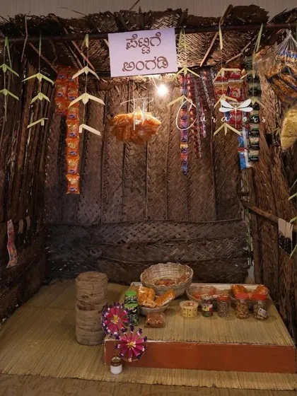 We bring creative concepts to life, like this nostalgic 'Pettige Angadi' or petty shop. It served as a unique photo booth and a conversation starter, filled with old-school snacks and charm for a milestone birthday.