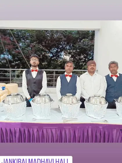 My team at Jankibai Madhavi Hall, dressed in uniform with bow ties, ready for an evening of service.