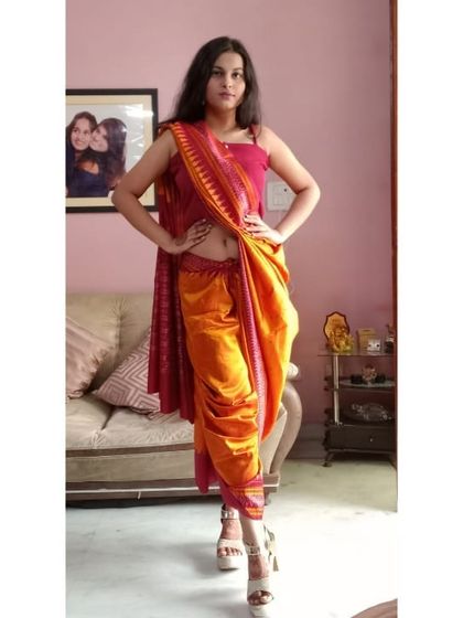 Here’s a fun and easy way to style a saree in a dhoti drape. I used a vibrant orange and pink saree to create this look, which is super comfortable and perfect for festive occasions when you want to move around freely. Paired with platform heels, it's a modern take on tradition.