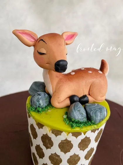 A sleeping fawn topper, showcasing how to create peaceful and gentle expressions.