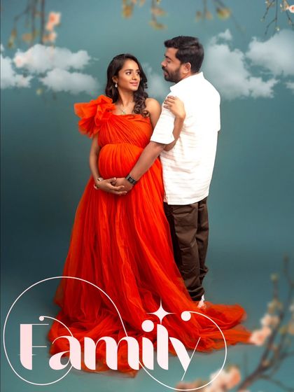 A romantic couple's portrait where the vibrant red gown truly pops. The word "Family" overlaid on the image emphasizes the new chapter they are beginning together.