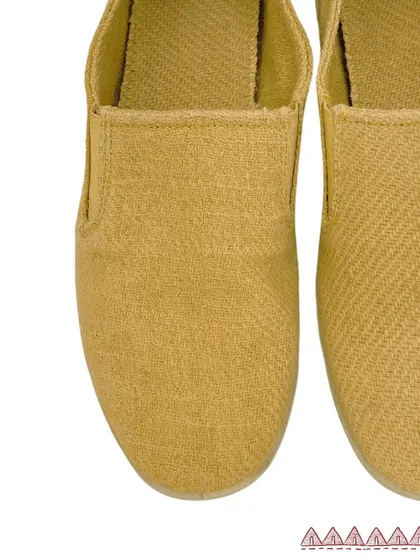A top-down view of our handcrafted Yaar Slip-on Shoes. Made from naturally dyed Harsil wool, the rich twill weave is visible, showcasing the texture and quality of the material.