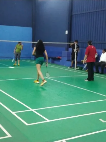 A glimpse of a mixed doubles match in action. Our courts are open to everyone, perfect for players of all skill levels to enjoy a friendly game of shuttlecock.