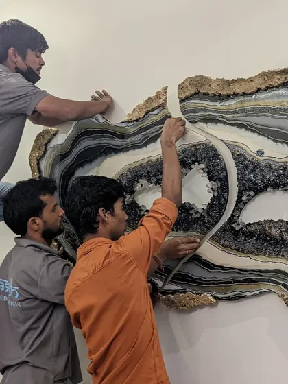 Bringing a large artwork to life is always a team effort. Here is my team carefully installing a custom geode piece. We handle every detail to ensure your art is perfectly placed.