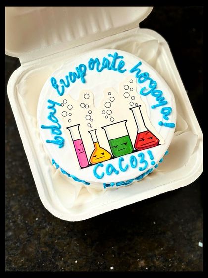 A nerdy and fun cake for a science lover! This design features colorful cartoon beakers and a funny chemistry-related Hindi phrase, "evaporate ho gaya."