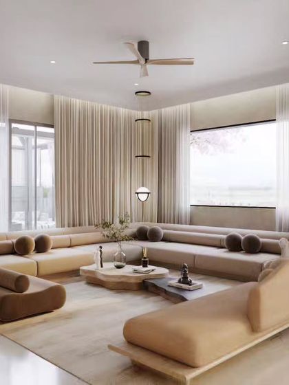 Two views of a minimalist living room with a large, modular sofa. The focus here is on the soft, neutral color palette and the abundance of natural light, creating a feeling of spaciousness and tranquility.