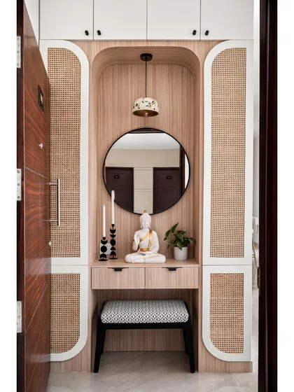 First impressions matter, which is why we love creating welcoming entryways. This Japandi-style foyer uses natural wood, rattan panels, and a calming Buddha statue to create a sense of peace and balance the moment you walk in.