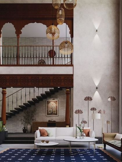 A view of the massive double-height living room in the Kanakapura Residence. We used brick cladding, Kota stone flooring, and a wooden jharokha to scale down the dramatic volume and create a cozy, traditional feel.