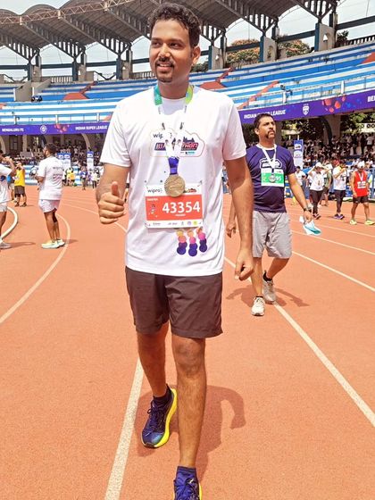 A proud walk on the stadium track after finishing a full marathon. The look of accomplishment says it all. Our group provides the motivation to keep going, even when it gets tough.
