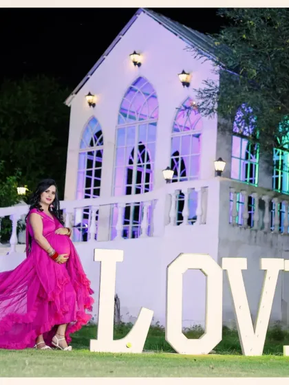 Our versatile chapel set is perfect for creating elegant and dreamy maternity portraits. The flowing gown and grand backdrop come together for a timeless photo, and our large 'LOVE' prop adds a special touch to celebrate your growing family.