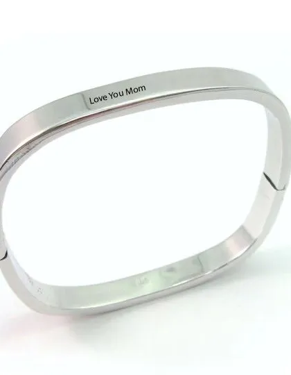 A simple and heartfelt gift, this polished silver kada is engraved with "Love You Mom". It features a secure clasp and a modern, minimalist design, making it a meaningful piece of jewelry for Mother's Day or any special occasion.
