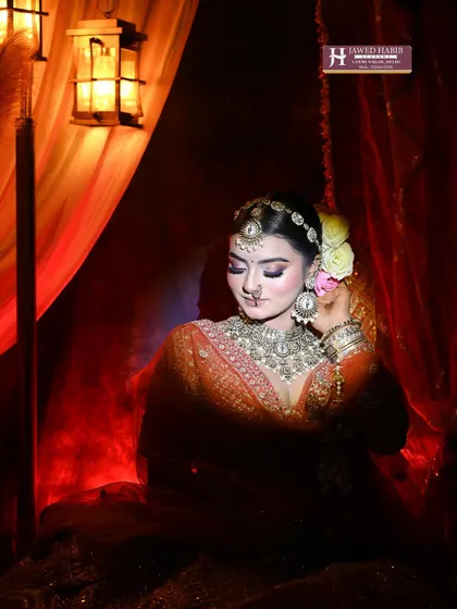 This artistic shot of a bride in a dramatic, low-light setting demonstrates how our makeup techniques hold up under different lighting conditions, a key skill for wedding photographers.