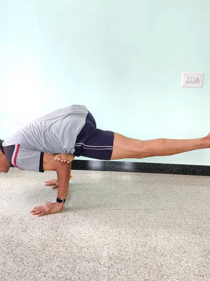 Eka Pada Galavasana (Flying Pigeon Pose). This arm balance combines a deep hip opening with the challenge of balancing on the hands. It requires both strength and flexibility.